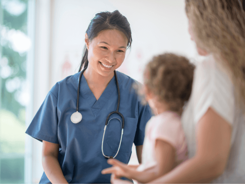 Paediatrician with mother and child